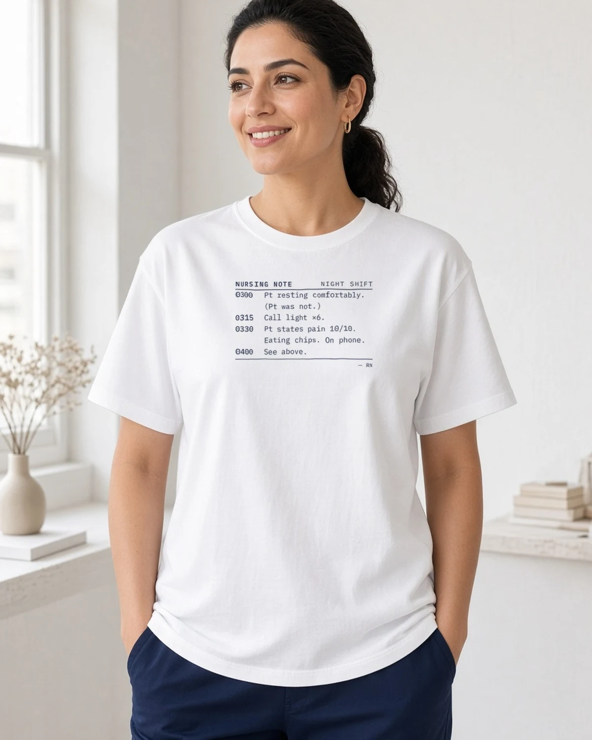 Model wearing the Funny Night Shift nurse charting note tee in White (Hanes Beefy-T)