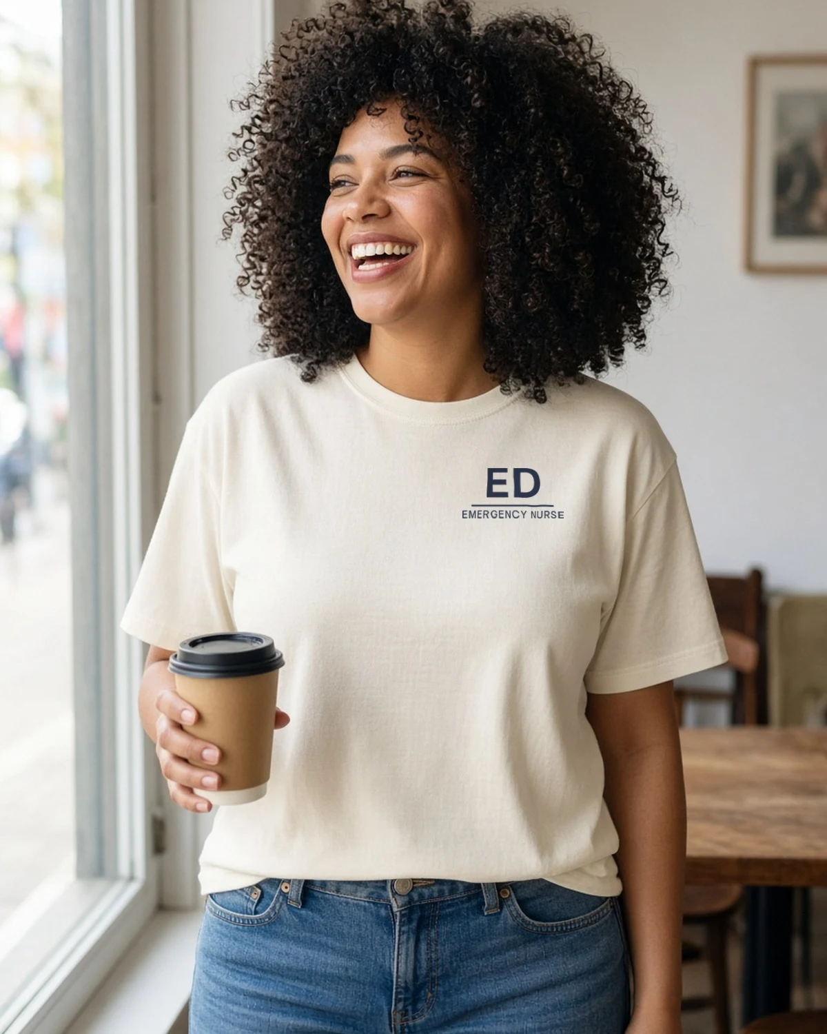 Model wearing the ED Emergency Nurse left-chest tee in Natural (Hanes Beefy-T)