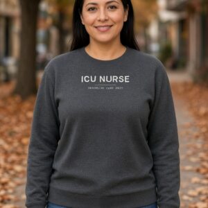 Woman wearing a charcoal ICU Nurse crewneck sweatshirt with the design centred on the chest